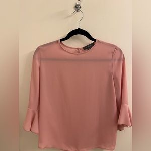 Pink top. Sleeves are half length. Top is light and good for spring